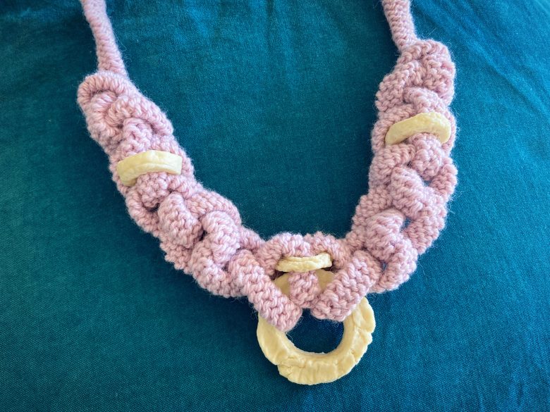 Fiddling necklace made from milk